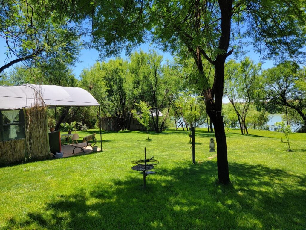 Freestanding braai on the lawn between the river hut and the Orange River