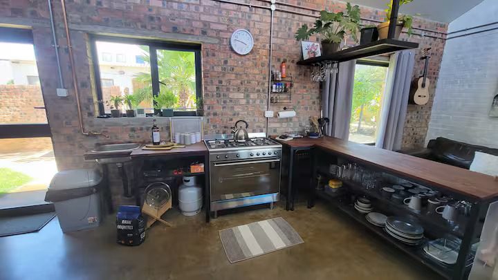 Kitchen counter, stove and window looking onto the garden at the Vacation Home